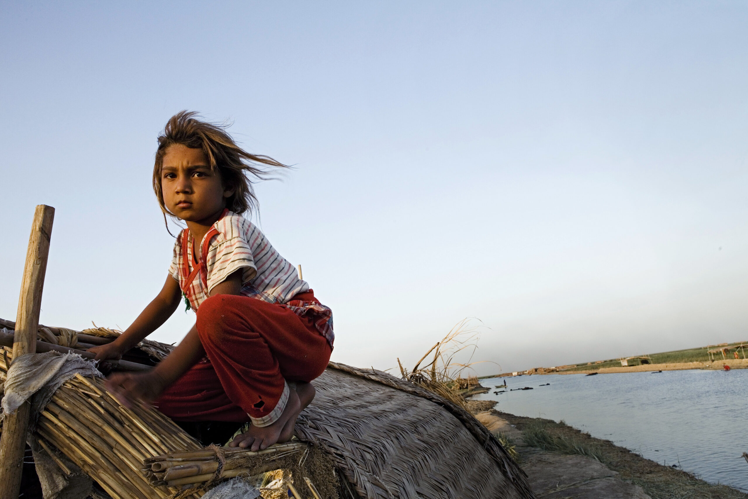 Bethul Shuaye on the roof of her house in Emlaq, Central Marshes on July 21st 2011 in Iraq. © Agata Skowronek